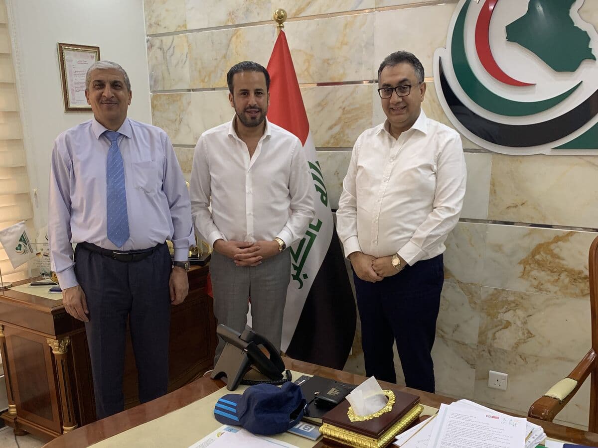 Kamal Benali with executives at the Iraqi National Business Council offices in Baghdad