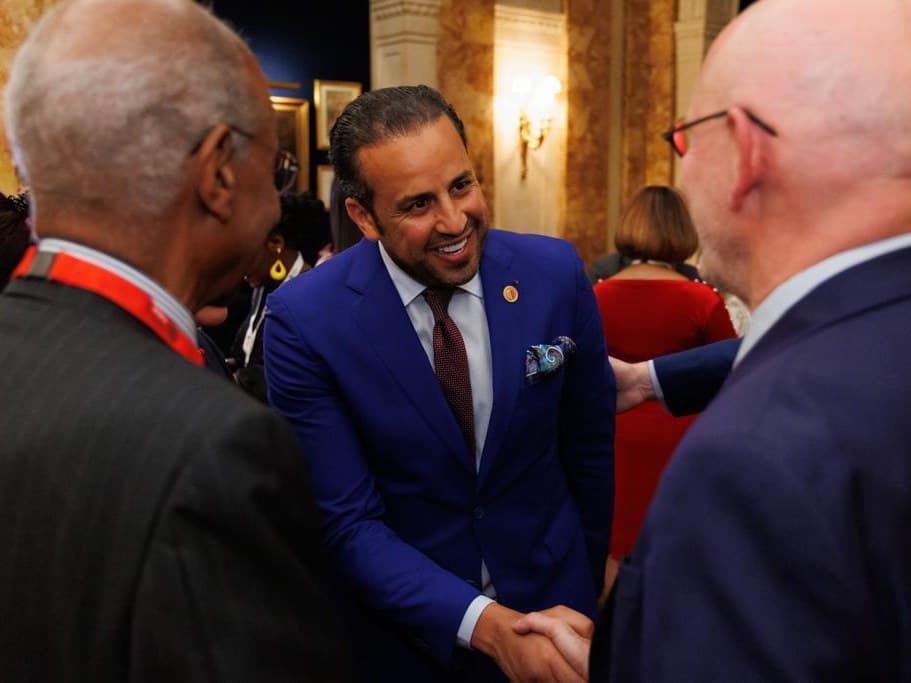 Kamal Benali greeting participants at a business forum